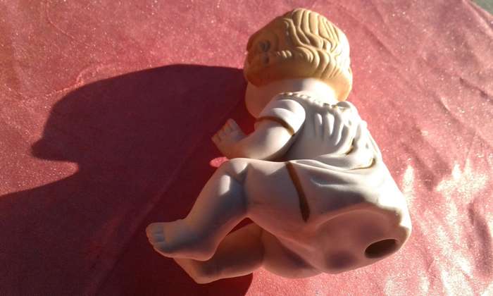 Little girl ornament.  No markings.
