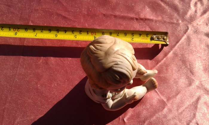 Little girl ornament.  No markings.
