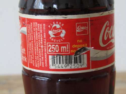 Vintage 250ml sealed Coca Cola Bottle, full