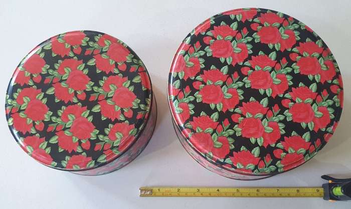 2 round biscuits tins as per photos