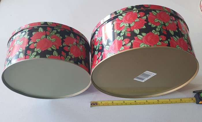 2 round biscuits tins as per photos