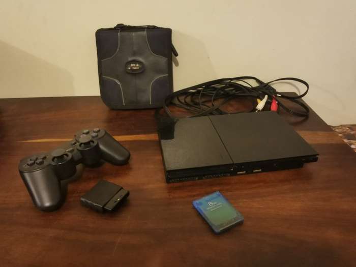PlayStation 2 with Wireless Remote and Memory Card Including CD Case with 13 Games