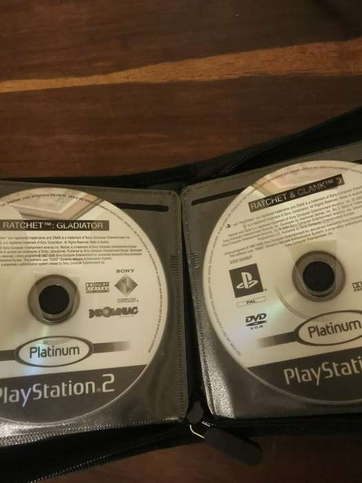 PlayStation 2 with Wireless Remote and Memory Card Including CD Case with 13 Games