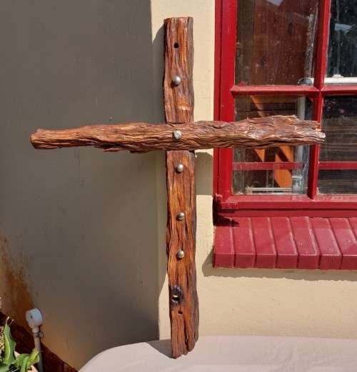 HANDMADE WOODEN CROSS DECORATED WITH NAILS AND VARNISH COATED