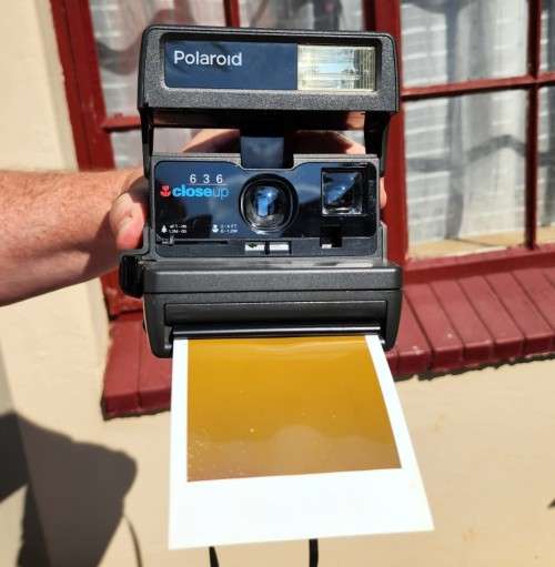 POLAROID 636 CLOSE-UP INSTANT CAMERA BOXED WITH OLD FILM CARTRIDGE AND TWO EXPOSED FILM SLIDES