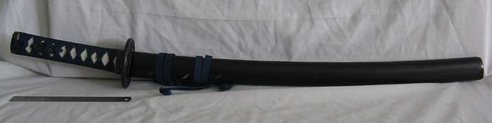 SWORD WITH CANE SCABBARD PURCHASED BY PREVIOUS OWNER IN JAPAN IN 1984.
