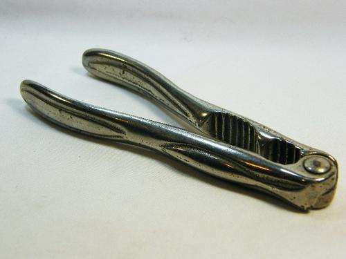 Vintage silverplated nutcracker with double opening - as per photo