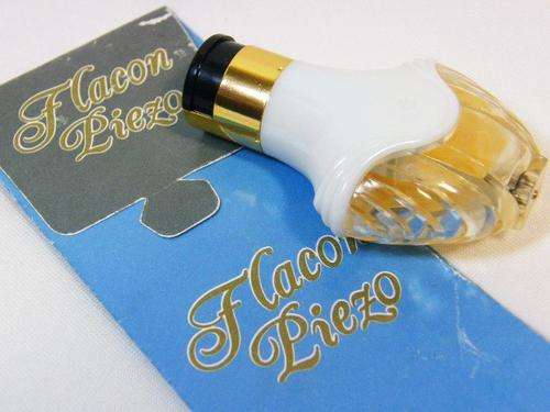 Flocan Piezo perfume shaped bottle gas lighter with original bag - as per photo