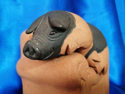 Vintage Large Pottery Pig Sleeping on a Chair