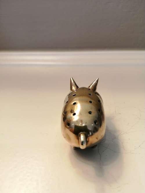 Pin cushion. A small brass pig with holes to insert your pins. English cir 1870.