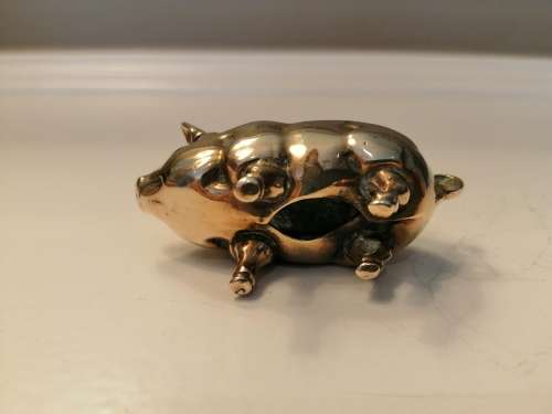 Pin cushion. A small brass pig with holes to insert your pins. English cir 1870.