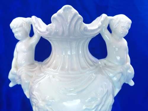 Faiarte blanc de china two-handled vase depicting cherubs angels