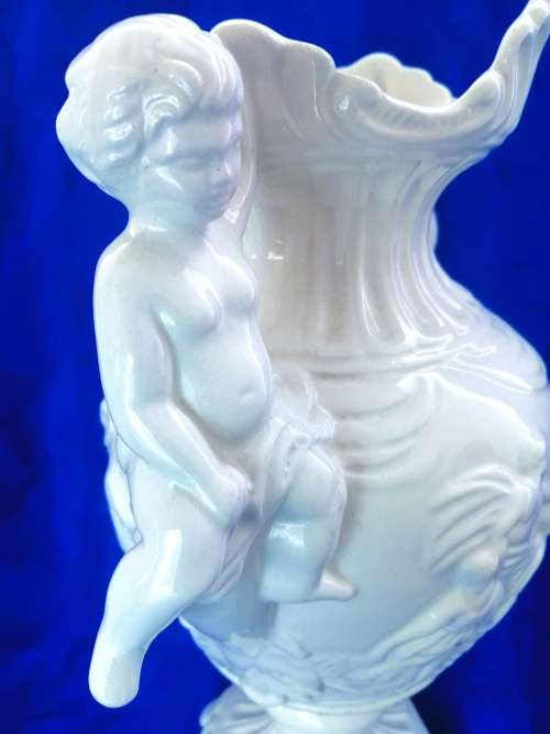 Faiarte blanc de china two-handled vase depicting cherubs angels