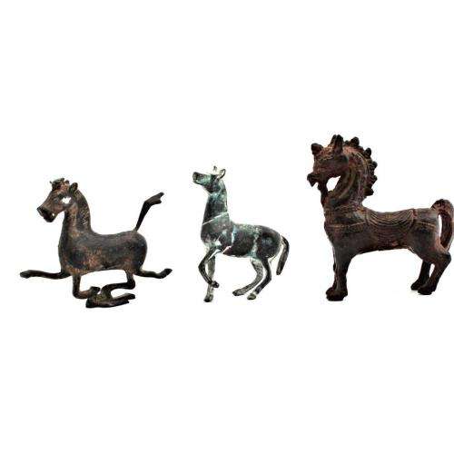 Three Oriental bronze figurines of horse