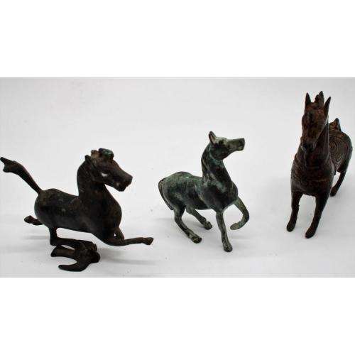 Three Oriental bronze figurines of horse