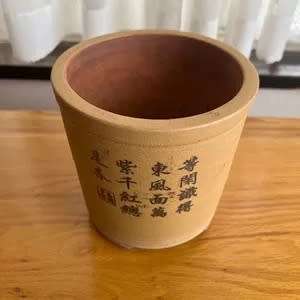 Used clay pot or potholder with small legs for inside or outside use