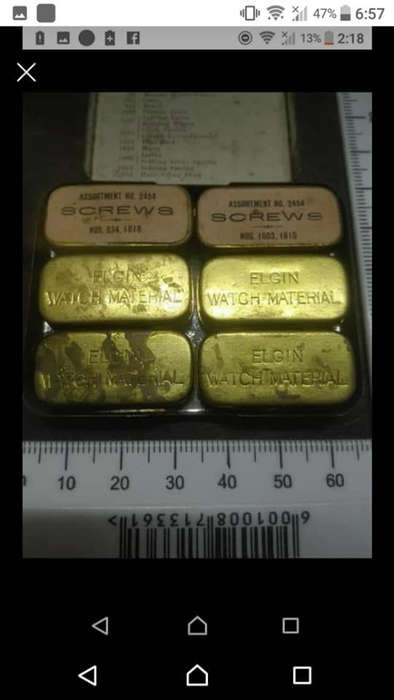 Antique Victorian Elgin National pocket watch parts. Six small brass tins inside bigger tin with sma