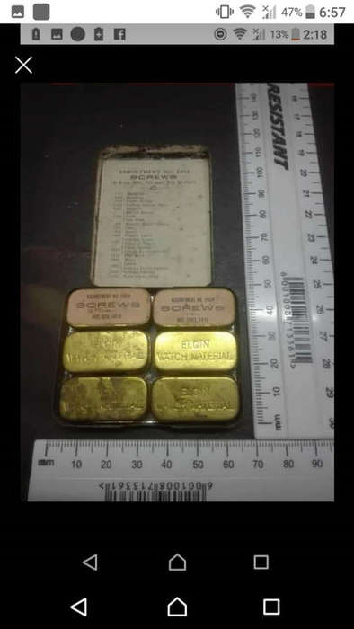 Antique Victorian Elgin National pocket watch parts. Six small brass tins inside bigger tin with sma