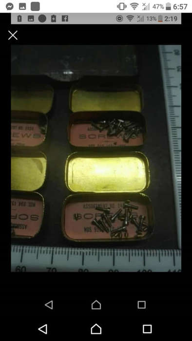 Antique Victorian Elgin National pocket watch parts. Six small brass tins inside bigger tin with sma