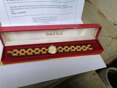 Working omega watch with original box. Valued at R35 000