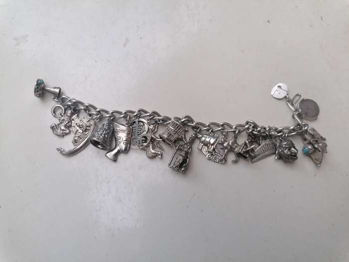 Wow stunning silver charms bracelet with 23 silver charms