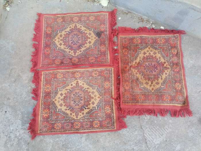 Small machine made carpets. Needs a good cleaning