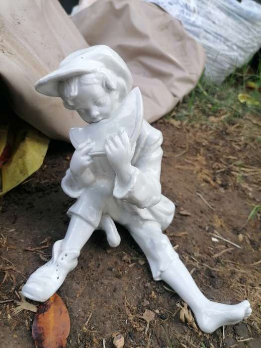 Cute porcelain figure. No markings
