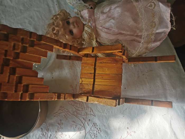 VINTAGE SMALL PORCELAIN DOLL ON ANTIQUE CHAIR