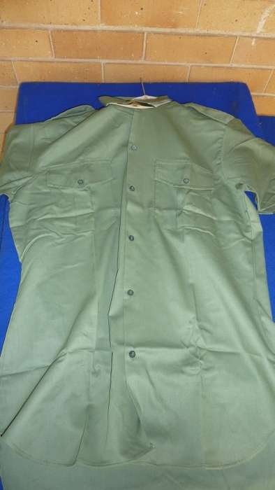 4B) 1970'S- RHODESIAN ARMY-OLIVE DRAPE-SHORT SLEEVE SHIRT-AS NEW-(STILL HAS CARDBOARD)-SIZE 41!