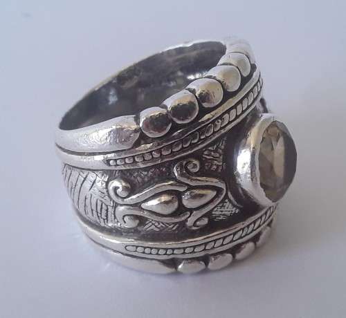 Solid sterling silver wide band ring with faceted citrine coloured stone.  Size: O.  Weight: 13.6g
