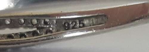 Solid sterling silver trilogy ring with clear centre stone and blue side stones. Size: N (17mm)