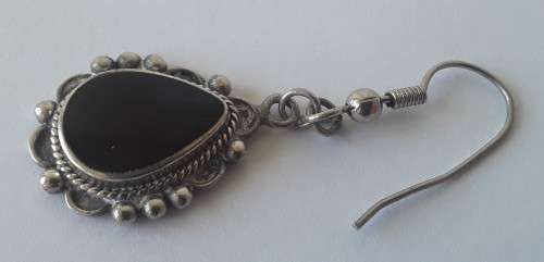 Solid sterling silver teardrop earrings with black stones. Possibly onyx