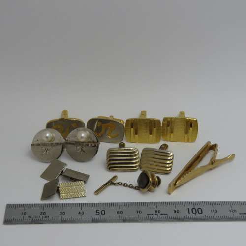 Lot of cufflinks and tie pins