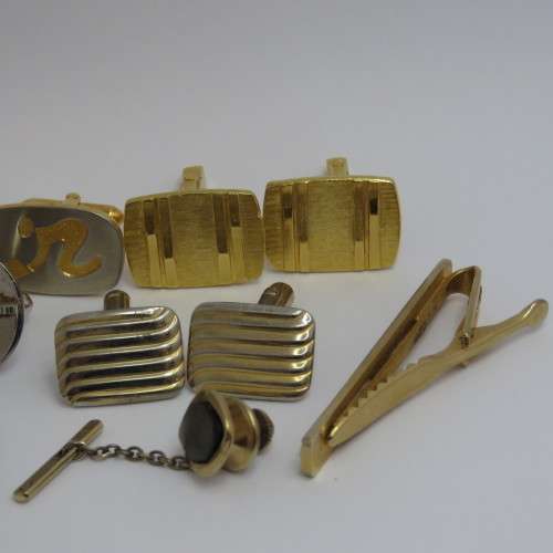 Lot of cufflinks and tie pins