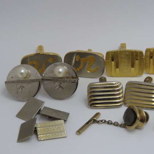 Lot of cufflinks and tie pins