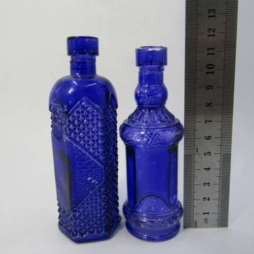 Pair of blue vintage glass bottles