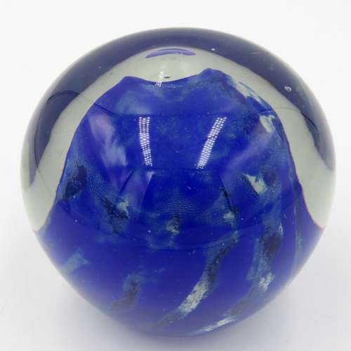 Vintage glass paperweight with blue design