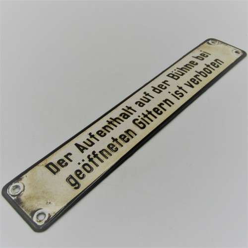 Vintage German enamel sign - `It is forbidden to remain on the stage when the bars are open`