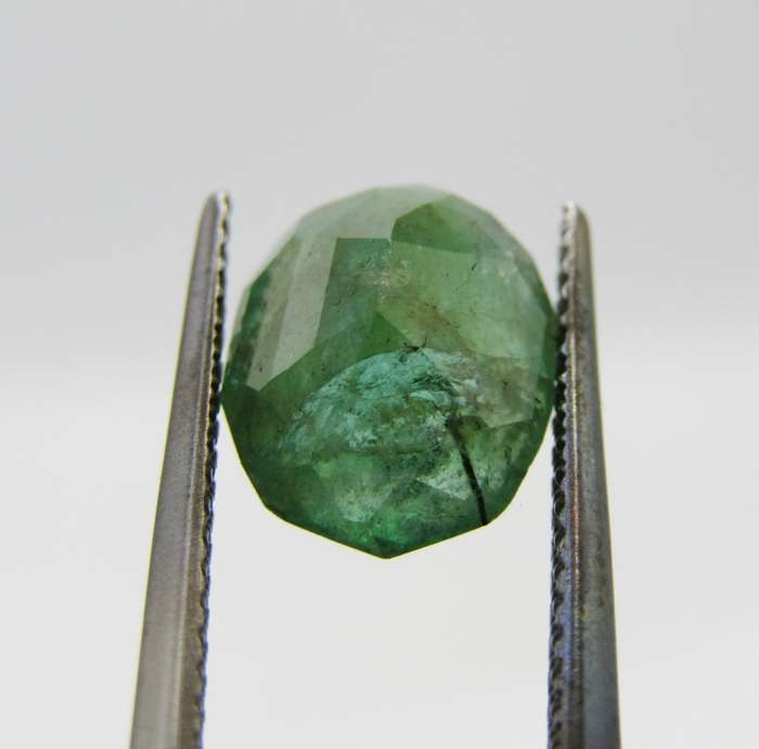 Natural Emerald of 2,99 carat oval mixed cut medium toned slight bluish green
