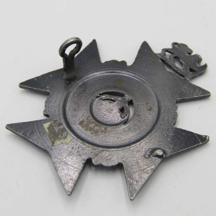 The Rhodesia Regiment cap badge - one lug