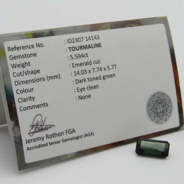 Dark toned Green Tourmaline of 5,59 carat Emerald cut with Gemlab certificate