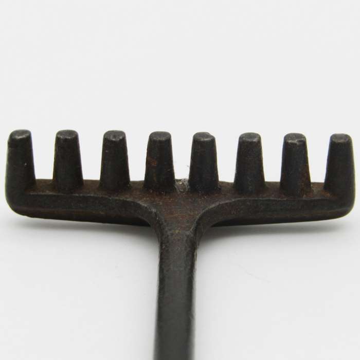 Antique miniature cast iron rake and garden hoe