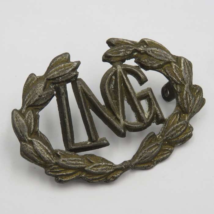 Light Machine gunner lead cast badge- wreath broken in centre
