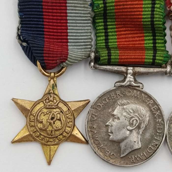 Set of 4 WW2 miniature medals with mentioned in despatched oak leaf