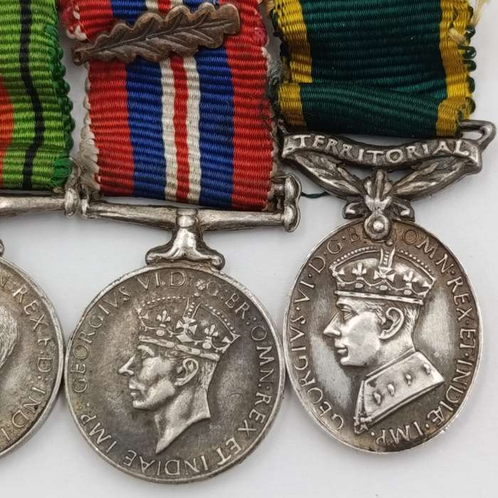 Set of 4 WW2 miniature medals with mentioned in despatched oak leaf