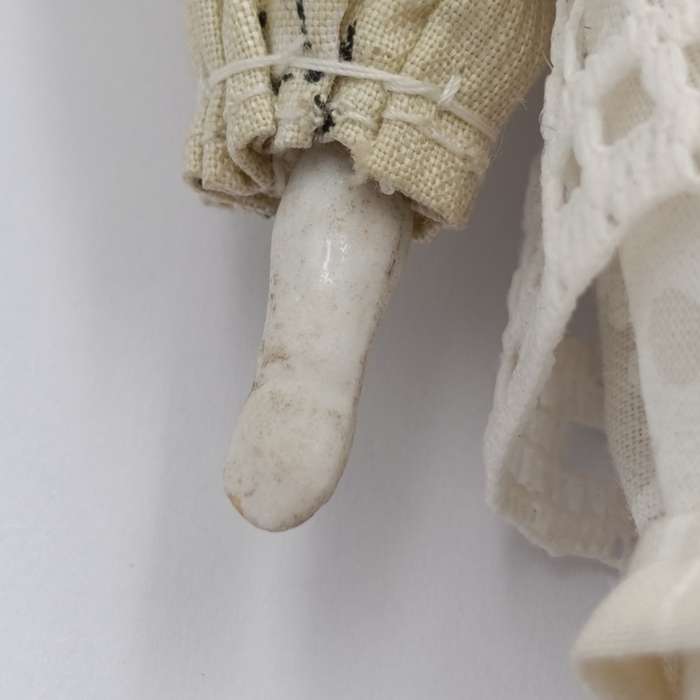Dark hair rosy cheeks antique doll - 17cm long