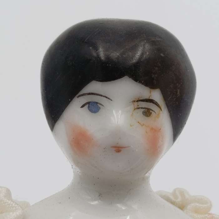 Dark hair rosy cheeks blue eyes antique doll - 19cm long - repaired hands