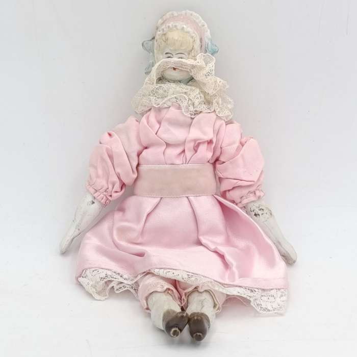 Bisque China head doll - 22cm high - chip on head - antique