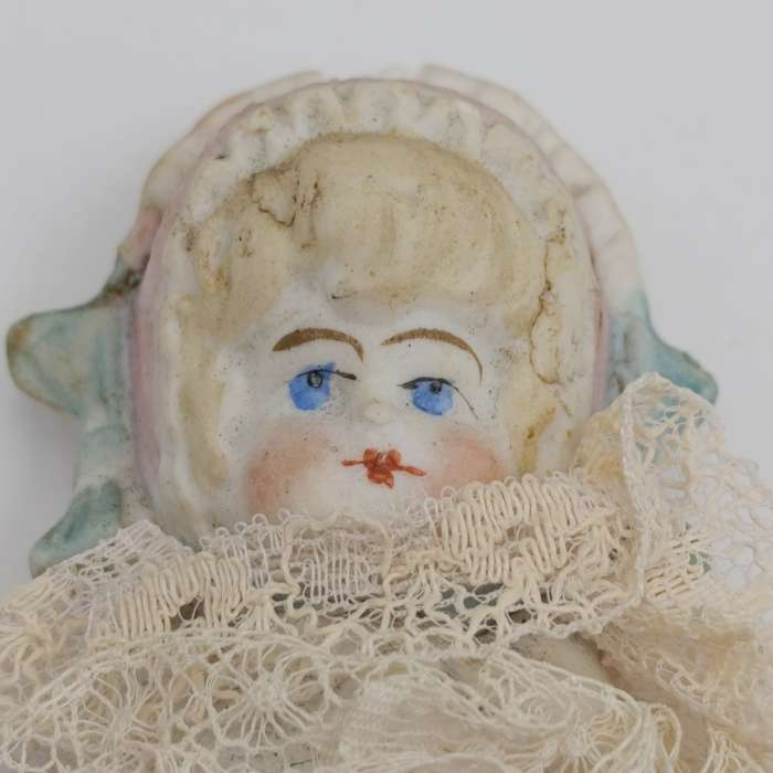 Bisque China head doll - 22cm high - chip on head - antique