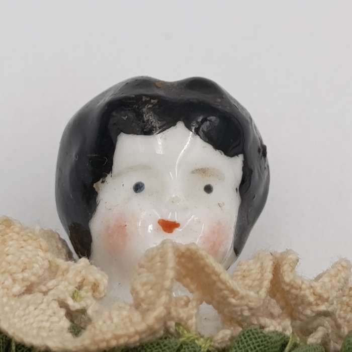 Dark hair rosy cheeks antique doll - 15cm long